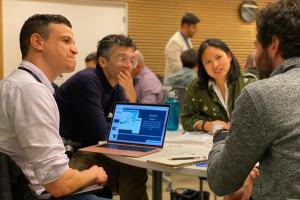 People talking at a workshop table