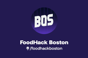 A purple image with "BOS" written in white font with "FoodHack Boston" written in white beneath it. 