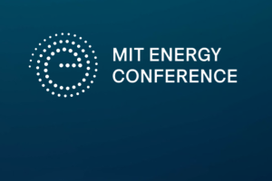 A blue background with white text and a circular logo displaying "MIT Energy Conference."