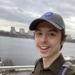 Christopher Maynard with the Charles River behind him